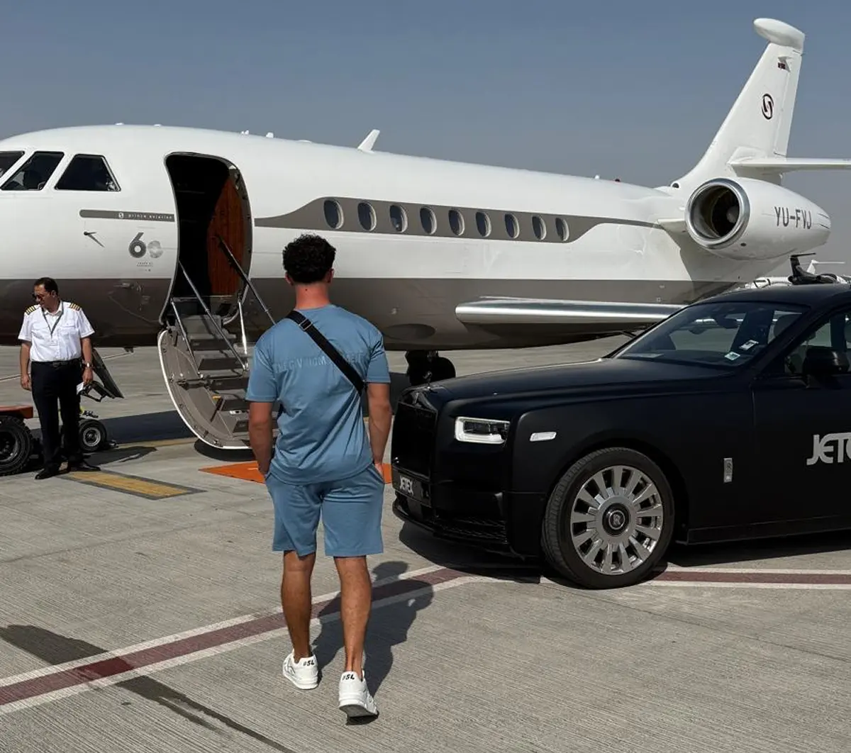 Modern workspace with an iMac displaying 'DO MORE'